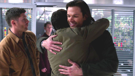 Sam seems happliy surprised by Cas' heartfelt hug.
